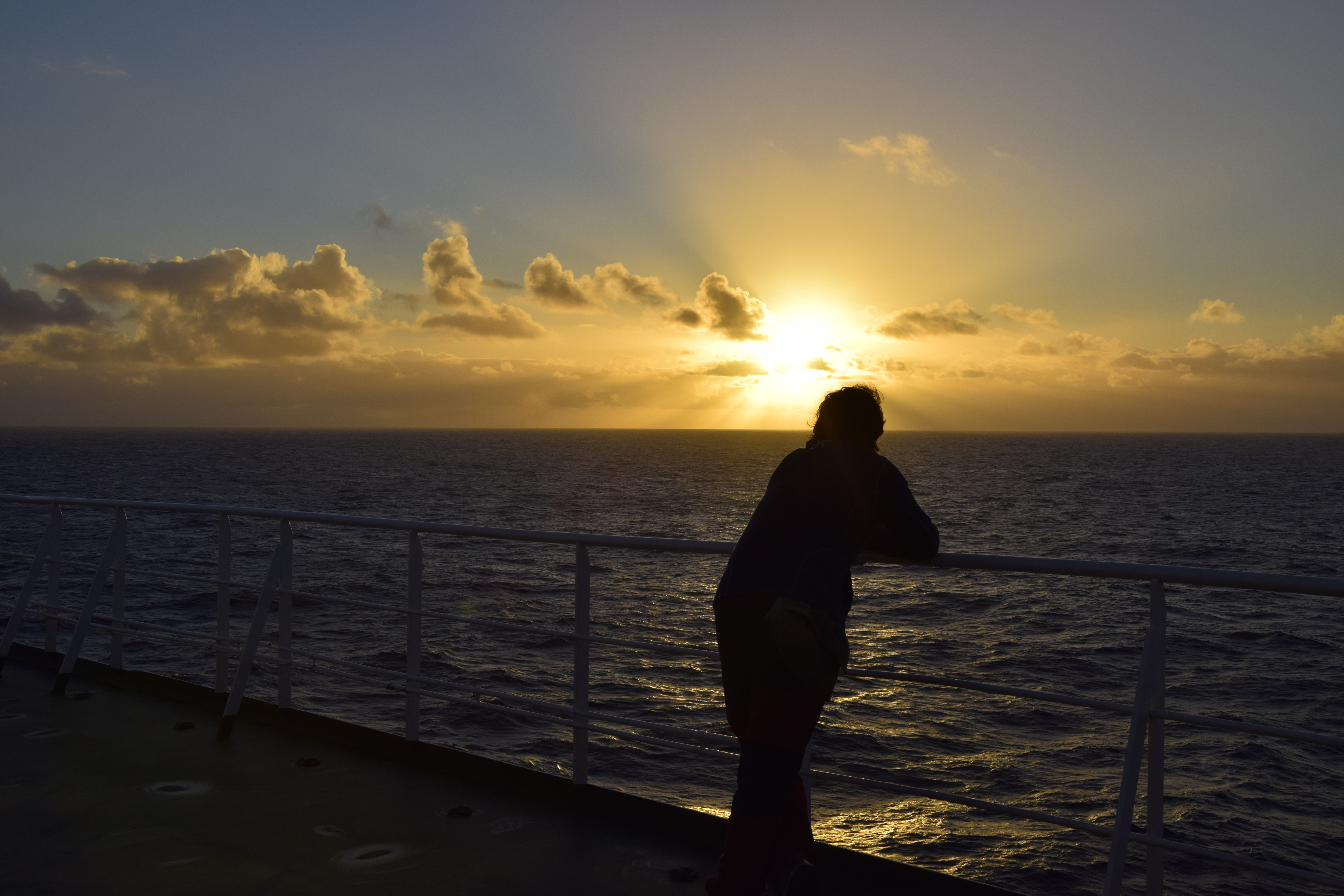 Christian watching one of the many sunsets we'd been able to have during our freighter trip across the Atlantic Ocean